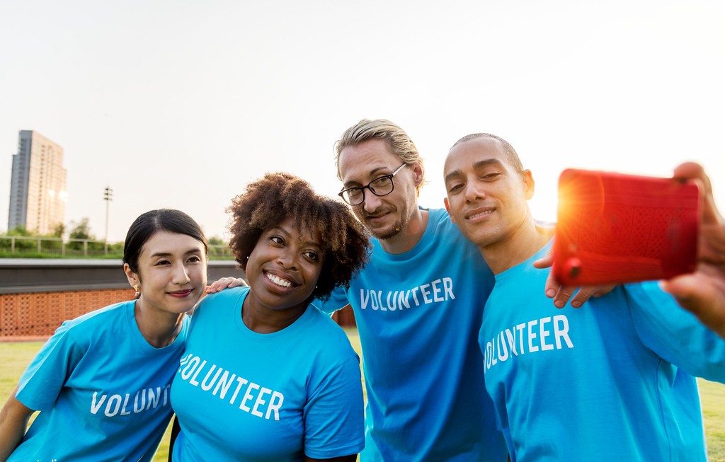 Diverse group of volunteers taking a selfie together